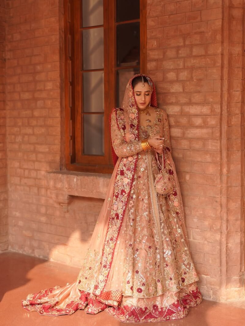 Bridal Lehenga in Soft Peach with Deep Red Embellished Borders